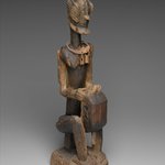Figure of a Seated Musician (Koro Player)