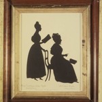 Cut Silhouette of Two Women Facing Right