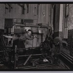 [Untitled] (Two Men Dismantling Metal Frame)