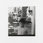 [Untitled] (Young Boy, other Children and Benches in Background)