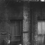 [Untitled] (Tenement, Child on Fire Escape, New York)