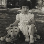 [Untitled] (Child Sitting on Stuffed Tiger)