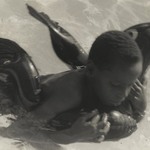 [Untitled] (Boy with Rubber Dolphin)
