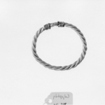 Bracelet Composed of Two Heavy Undecorated Bands Braided to Form a Loop
