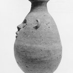 Bottle with Grotesque Face