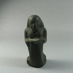Small Figure of a Man Kneeling and Holding Tablet Before Him