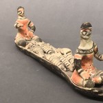 Canoe with Two Seated Figures