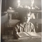 [Untitled](Young Girl Seated at Desk in School)