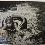 [Untitled] (Juanita Floating in Inner Tube)