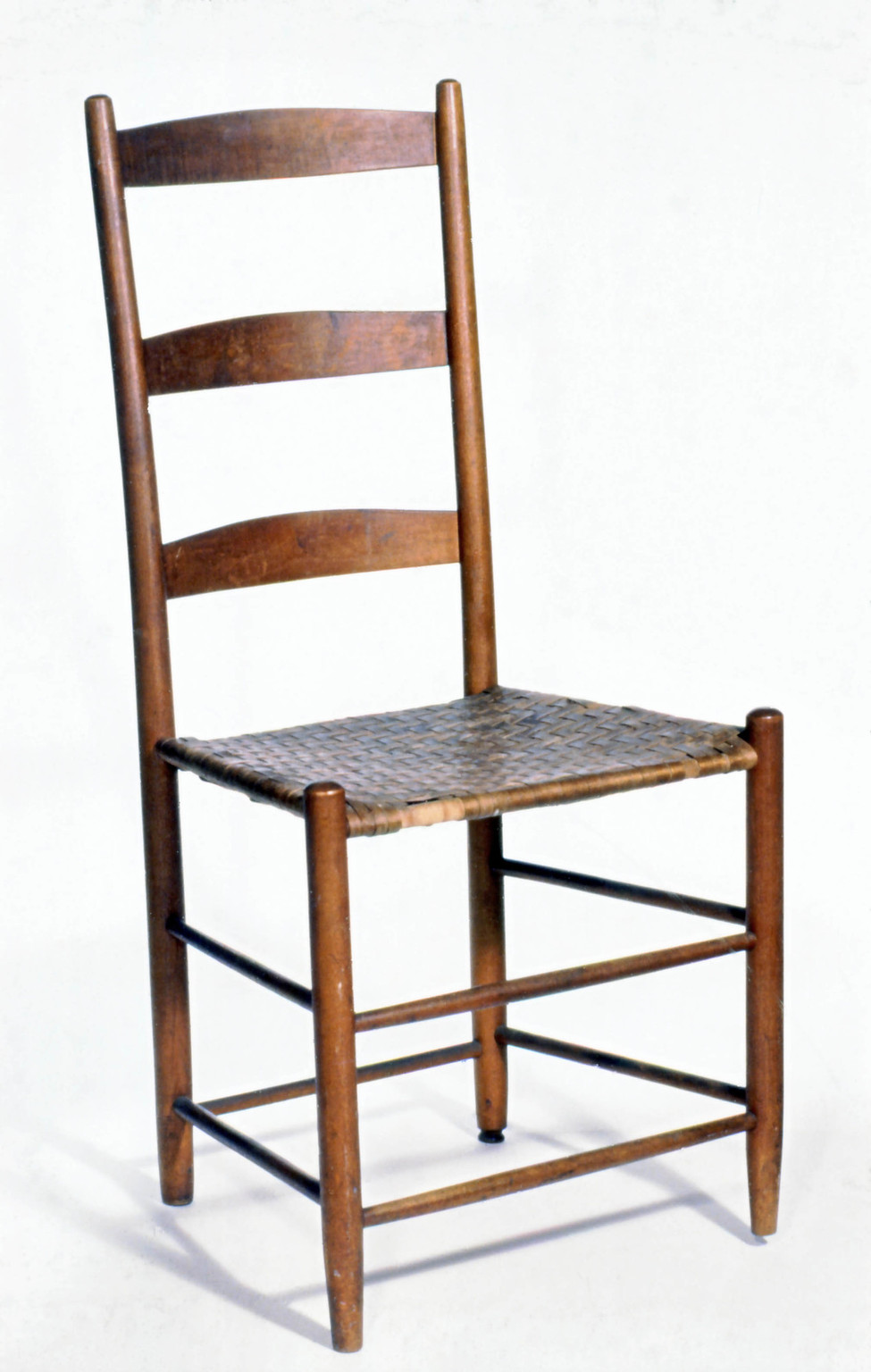Chair created by the shakers in a medium wood