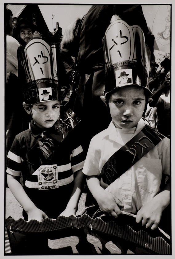 Ethel Wolvovitz (American, born 1946). <em>Two Children and Rabbi Schneerson in Hats, La'as B'omer, Crown Heights, Brooklyn</em>, 1993. Gelatin silver print, sheet: 14 x 10 7/8 in. Brooklyn Museum, Gift of the artist, 1994.90.1. © artist or artist's estate (Photo: Brooklyn Museum, 1994.90.1_PS20.jpg)