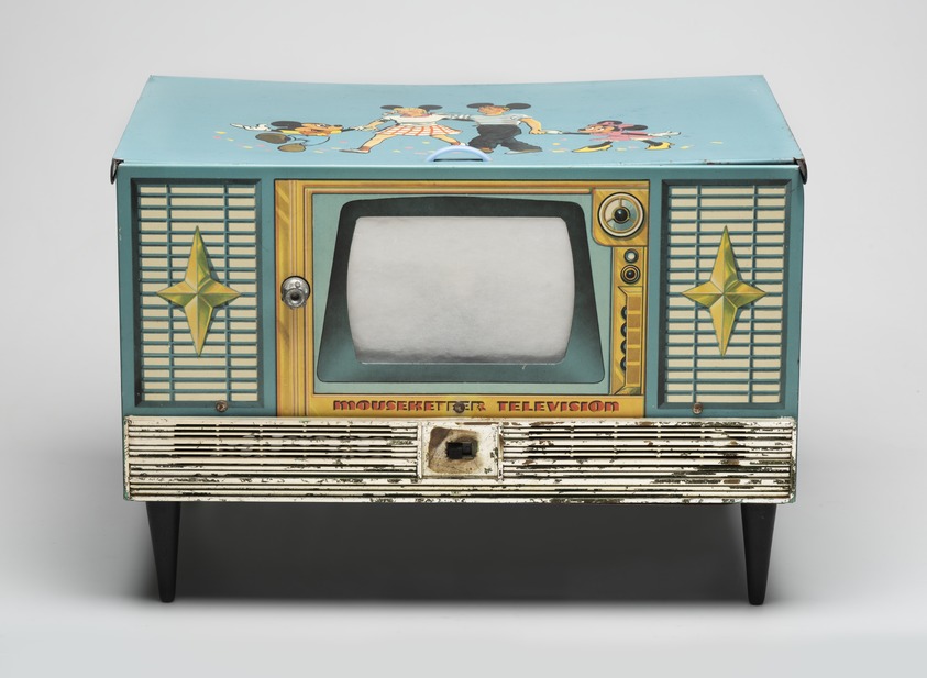 T. Cohn, Inc. (ca. 1900-1979). <em>"'Superior' Mouseketeer Television", Model 300</em>, ca. 1955. Printed metal, plastic, rubber, wood, 9 3/8 x 13 5/8 x 9 1/4 in. (23.8 x 34.6 x 23.5 cm). Brooklyn Museum, Maria L. Emmons Fund, 2014.14 (Photo: Brooklyn Museum, 2014.14_view01_PS11.jpg)