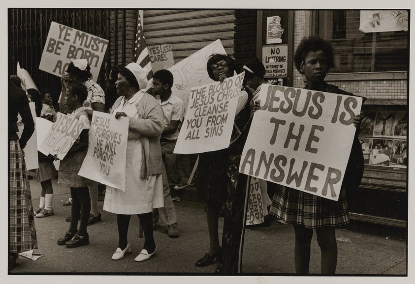 Marilyn Nance (American, born 1953). <em>Jesus is the Answer, Street Evangelists, Brooklyn, NY</em>, 1975. Gelatin silver print, 8 × 10 in. (20.3 × 25.4 cm). Brooklyn Museum, Purchased with funds given by the Charina Endowment Fund, 2021.13.4. © artist or artist's estate (Photo: Brooklyn Museum, 2021.13.4_PS20.jpg)