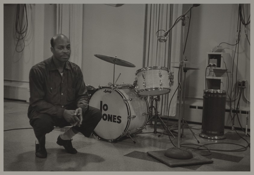 Milt Hinton (born Vicksburg Mississippi, active Chicago, IL, 1910–2000). <em>Jo Jones, recording studio, N.Y.C., c. 1956 (w/ bass drums)</em>, ca. 1956. Gelatin silver print, 11 × 14 in. (27.9 × 35.6 cm). Brooklyn Museum, Gift of David G. Berger and Holly Maxson, 2023.80.8. © artist or artist's estate (Photo: Brooklyn Museum, 2023.80.8_PS20.jpg)