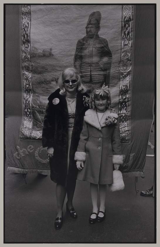 Victor Friedman (American, born 1930). <em>Mother and Daughter, St. Patricks Day Parade</em>, 1974–1975 (possibly). Gelatin silver print, image: 9 x 5 3/4 in. (22.9 x 14.6 cm). Brooklyn Museum, Gift of the artist, 83.76.1. © artist or artist's estate (Photo: Brooklyn Museum, 83.76.1_PS20.jpg)