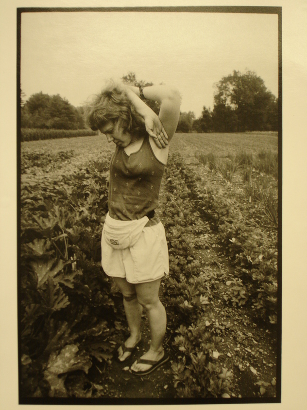 Rosalie Winard. <em>Jessy Park with Her Arms Raised in a Vegetable Garden, Williamstown, MA, from the Born Electrical Series</em>, 1996. Gelatin silver print, image: 7 7/8 x 11 1/2 in. (19.9 x 29.3 cm). Brooklyn Museum, Gift of Mary McClean, 1997.98.4. © artist or artist's estate (Photo: Brooklyn Museum, CUR.1997.98.4.jpg)