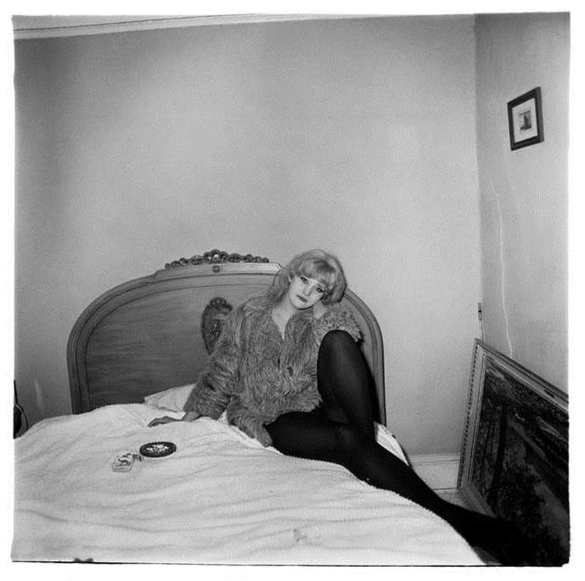 Diane Arbus (American, 1923-1971). <em>Girl in a Coat Lying on Her Bed, N.Y.C.</em>, 1968. Gelatin silver photograph, image: 14 3/8 × 14 3/8 in. (36.5 × 36.5 cm). Brooklyn Museum, Gift of Jeffrey Fraenkel & Frish Brandt, 2018.65.1. © artist or artist's estate (Photo: Image courtesy the artist, CUR.2018.65.1_DianeArbus_photograph.jpg)