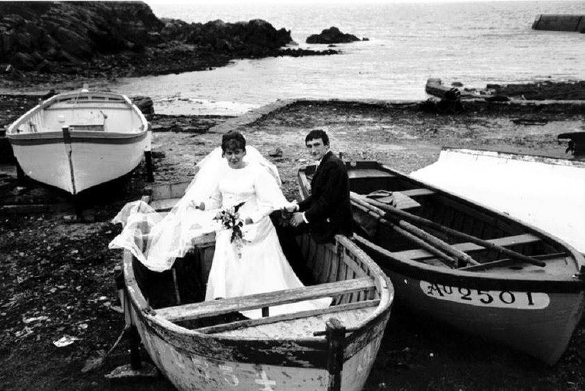 Mary Ellen Mark (American, 1940–2015). <em>Wedding Couple in Boat on Beach, France</em>, 1970; printed ca. 1970. Gelatin silver print, Sheet: 11 × 13 15/16 in. (27.9 × 35.4 cm). Brooklyn Museum, Gift of Howard Greenberg, 2019.50.11. © artist or artist's estate (Photo: Image courtesy of the estate of Mary Ellen Mark, CUR.2019.50.11_MaryEllenMarkEstate_photograph.jpg)