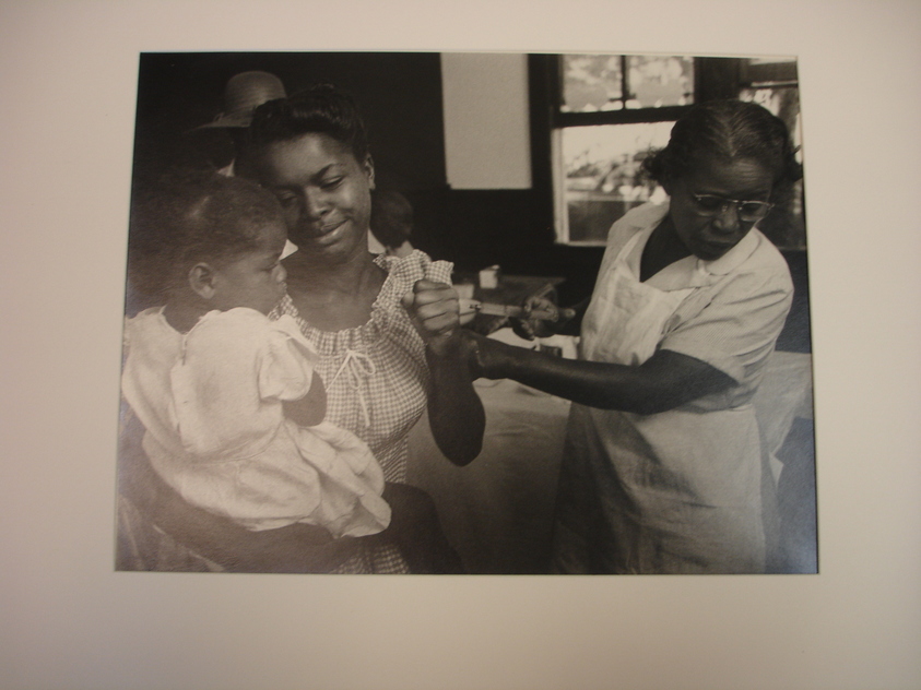 W. Eugene Smith (American, 1918-1978). <em>[Untitled] (Maude Callen Giving Shot to Woman Holding Little Girl)</em>, 1951. Gelatin silver print, Sheet: 11 x 14 in. (27.9 x 35.6 cm). Brooklyn Museum, Gift of Philip Goutell, 87.245.2. © artist or artist's estate (Photo: Brooklyn Museum, CUR.87.245.2.jpg)