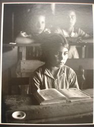 W. Eugene Smith (American, 1918-1978). <em>[Untitled](Young Girl Seated at Desk in School)</em>, 1950. Gelatin silver photograph, Sheet: 14 x 11 in. (35.6 x 27.9 cm). Brooklyn Museum, Gift of Philip Goutell, 87.245.34. © artist or artist's estate (Photo: Brooklyn Museum, CUR.87.245.34.jpg)